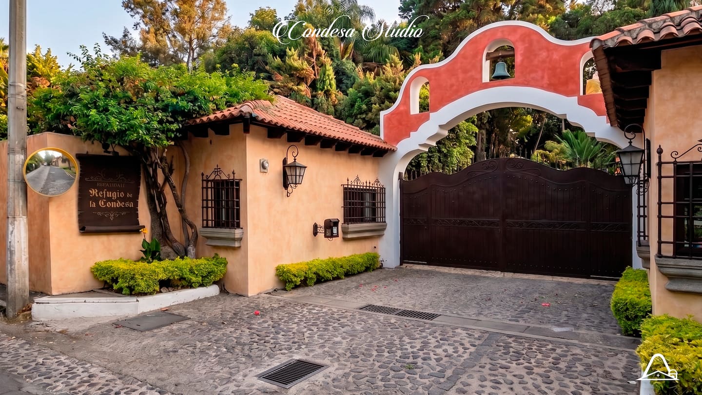 The cobbled entrance and arch of the gated community