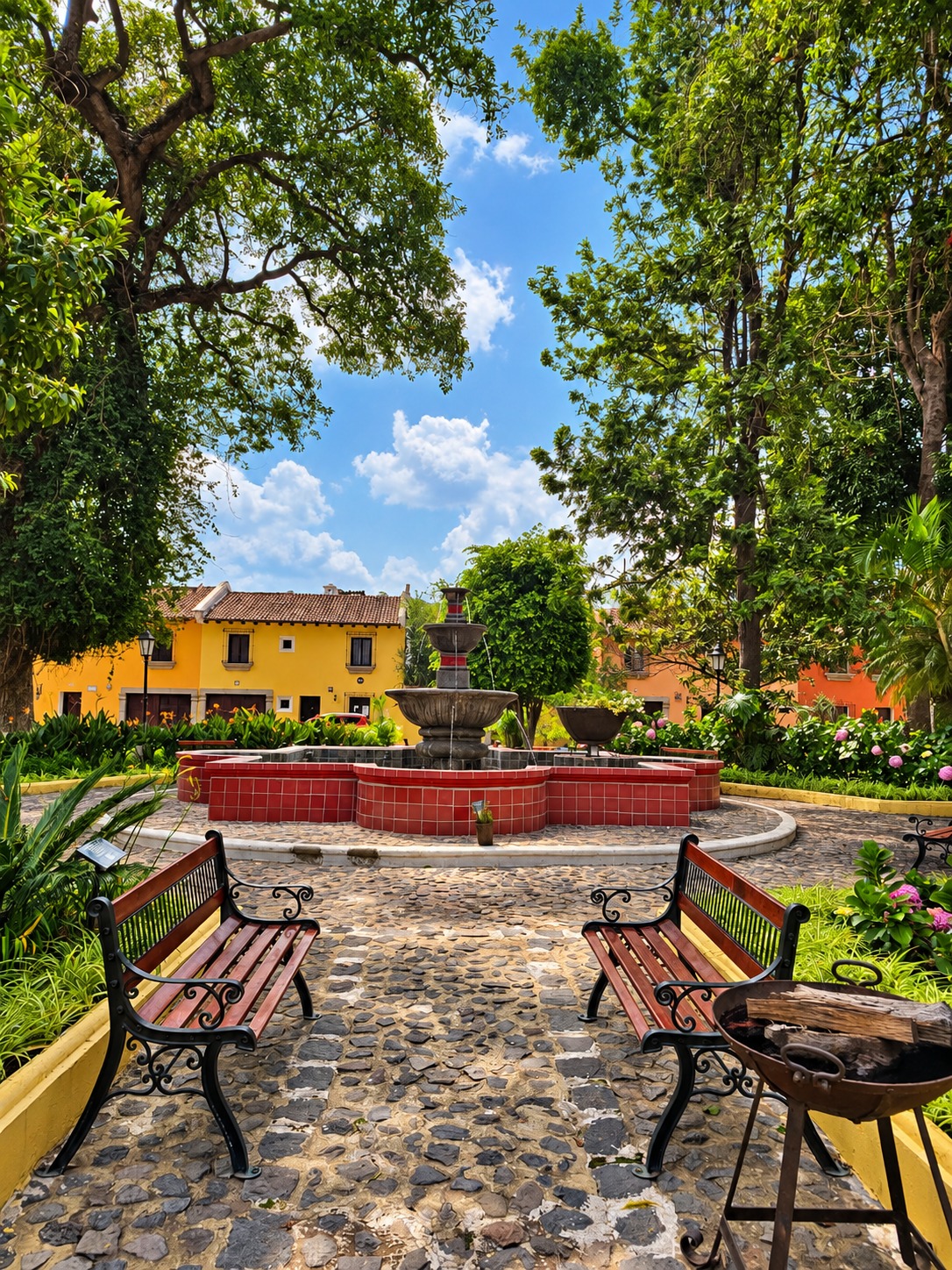 The community park outside Condesa Studio, with benches facing the fountain